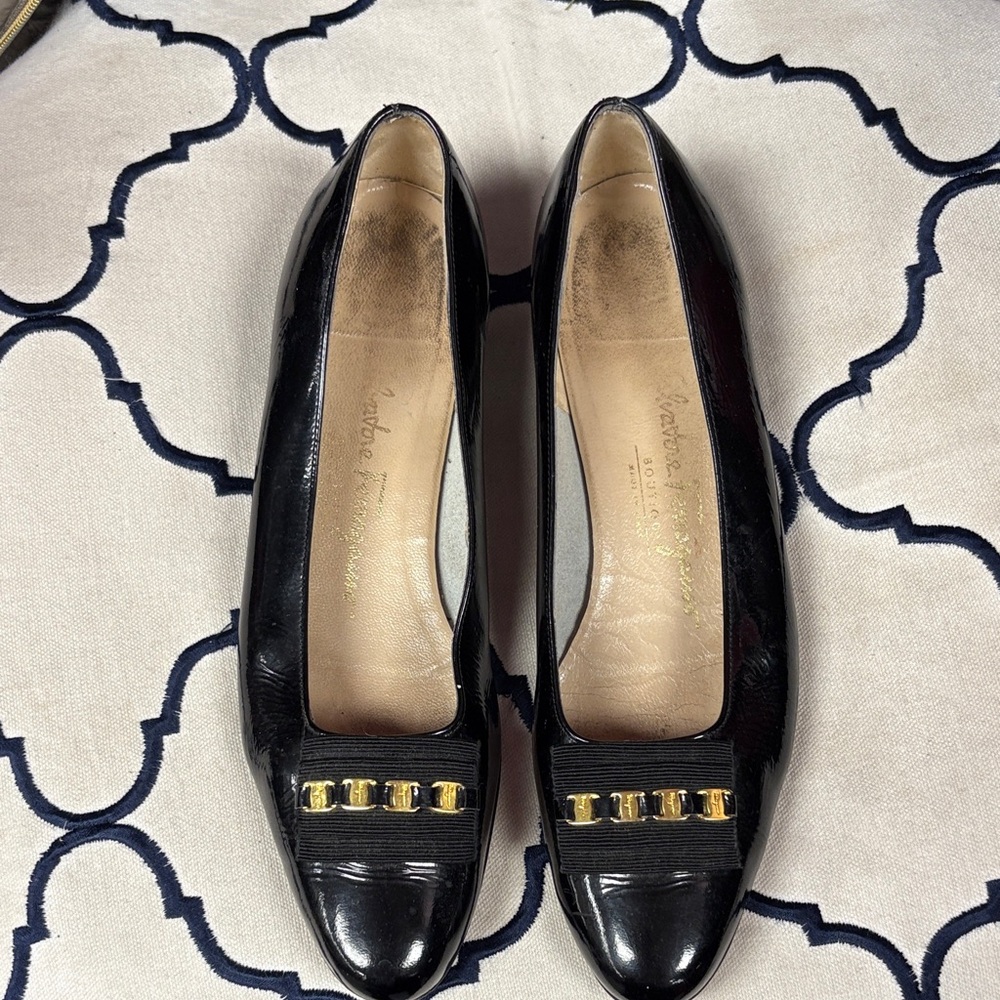 Salvatore Ferragamo Black Flats with Gold Detailing